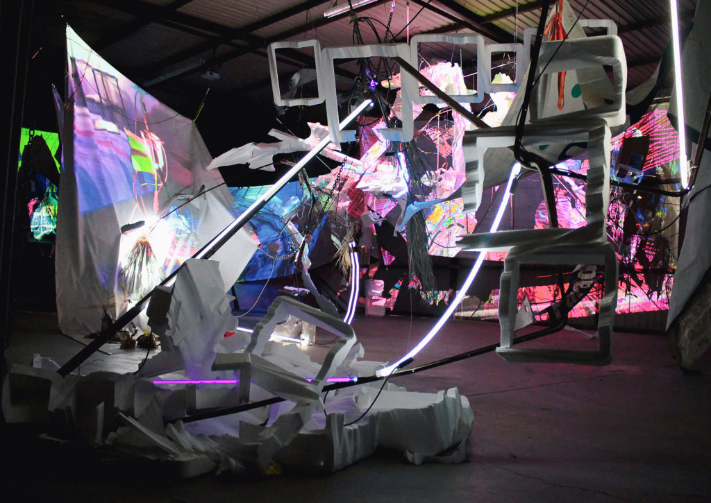 A complex media installation with found objects and lights